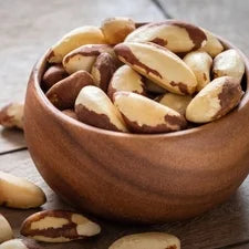 Wooden bowl filled with Brazil nuts, the top natural source of selenium for immune support. 