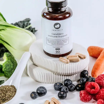 CerviHero Immune Support supplement bottle surrounded by vegetables and fruits on a white background for immune and cervical health support