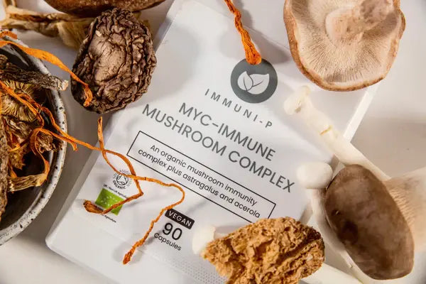 Myc Immune Mushroom Complex supplement featuring different medicinal mushrooms, including shiitake, chaga, maitake, reishi, and lion’s mane for immune system support.